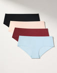 Set of four pairs of seamless underwear in black, beige, burgundy, and blue on a light gray background