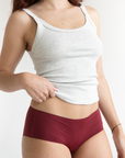 Model in sustainable burgundy seamless undies that don't ride up