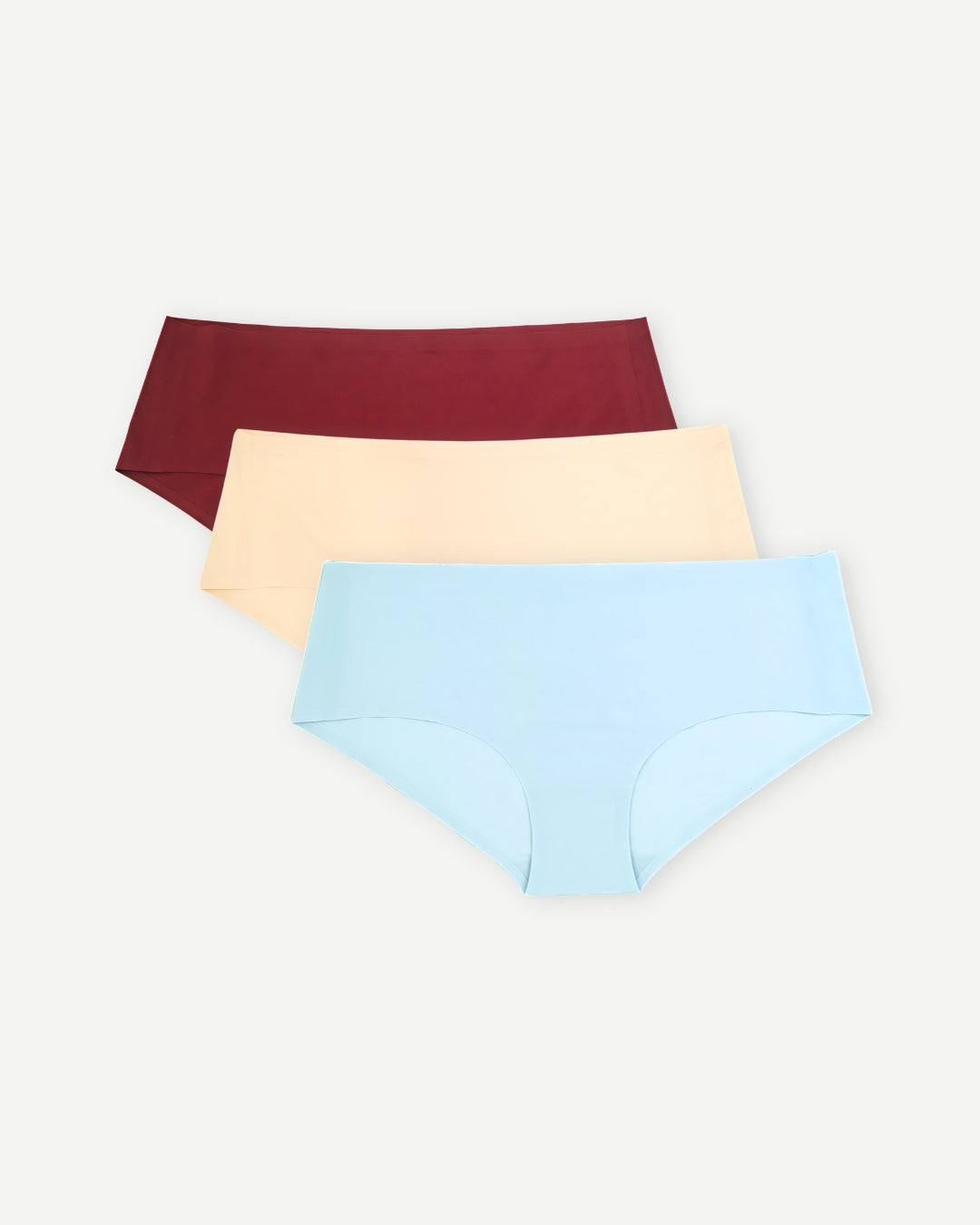 Set of three seamless undies in burgundy, tan, and blue